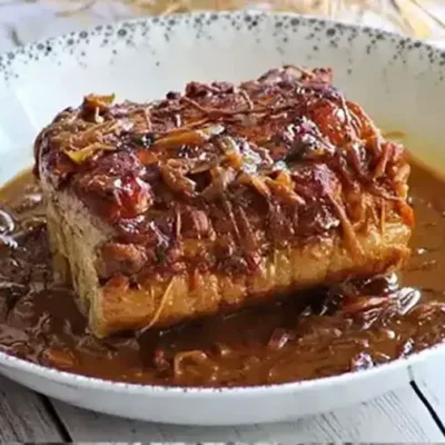 Rôti de Porc aux Oignons et Miel Savoureux